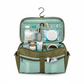 Olive green travel toiletry bag open showing multiple compartments and hanging hook, flat lay on white background